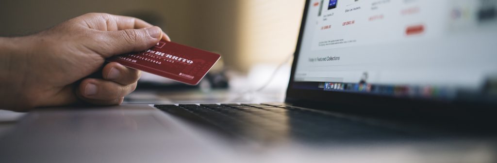 Person using credit card to check out online